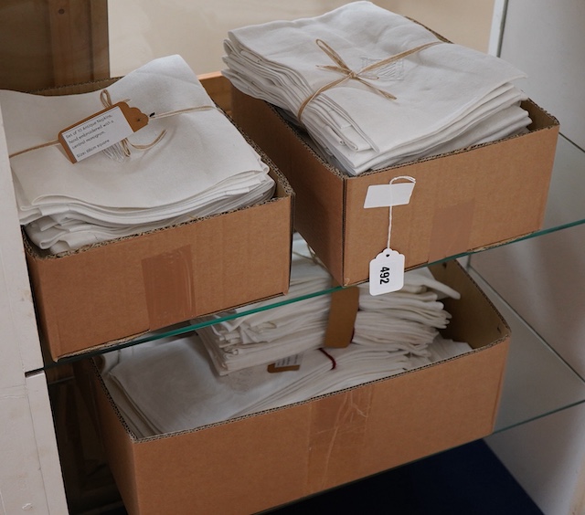 A collection of four sets of ten monogrammed French linen napkins and a similar set of twelve napkins, various odd sets of English Damask napkins, a large damask table cloth and a set of hand towels.